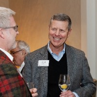 David Hooker smiling in conversation